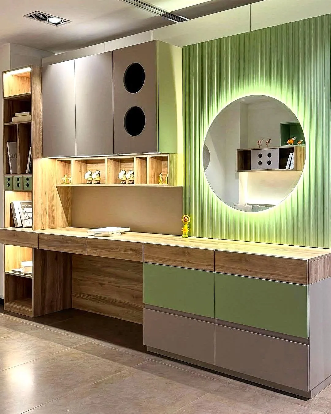 Children's bedroom by Gambini – oak desk, wall storage and round mirror on a fluted green wall