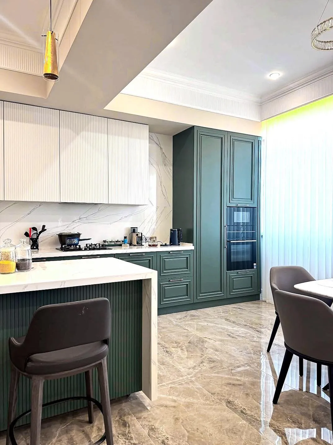 Kitchen by Gambini – island with breakfast seating and integrated appliances