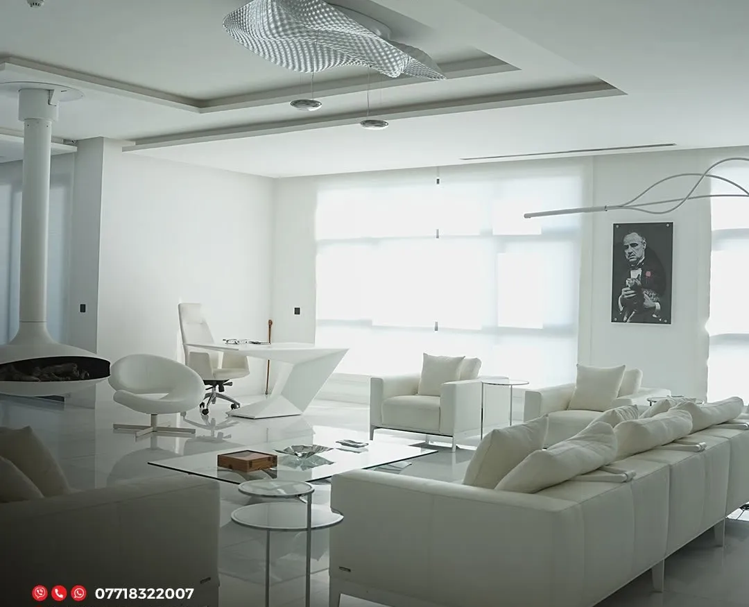 Luxury penthouse by Gambini – lounge with artwork and glass tables