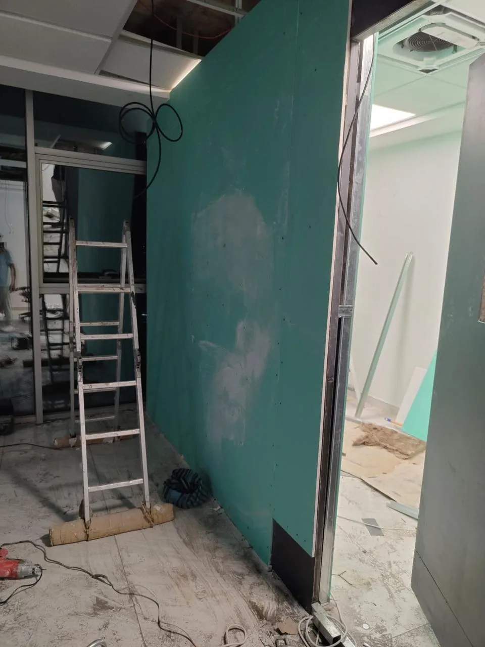 Door opening framed in metal studs with laser alignment